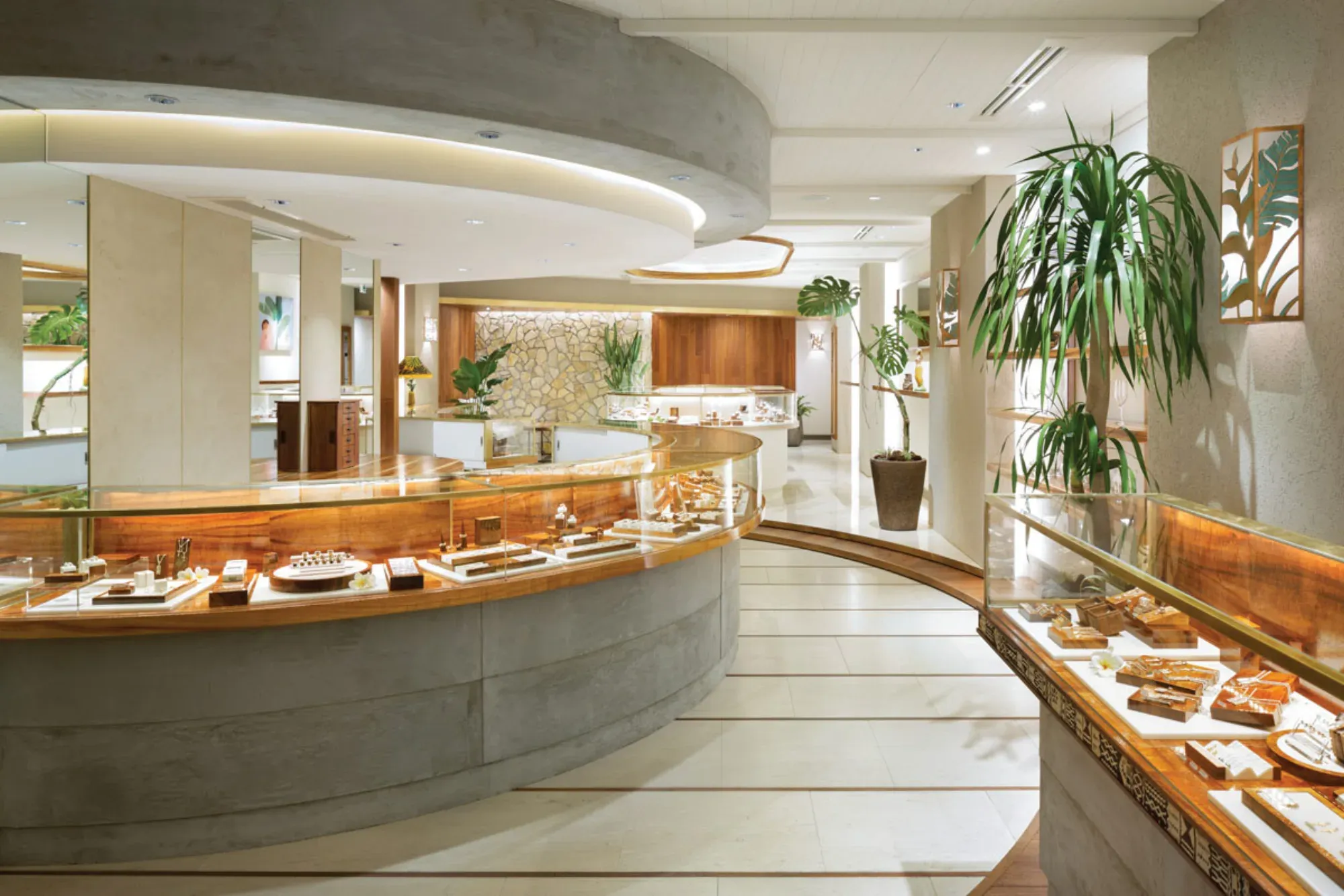 A curved SHOGI interior corridor lined with lit wood-and-glass display cases.